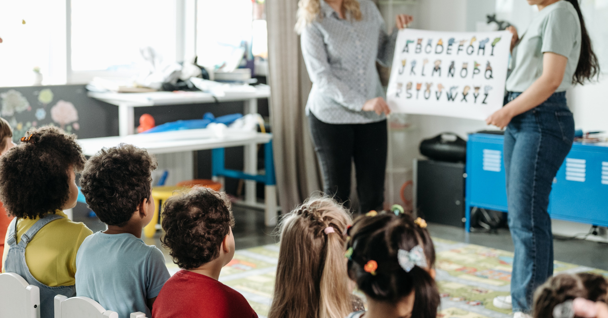 Lifestyle photo placeholder — educator or classroom mood. No identifiable children.